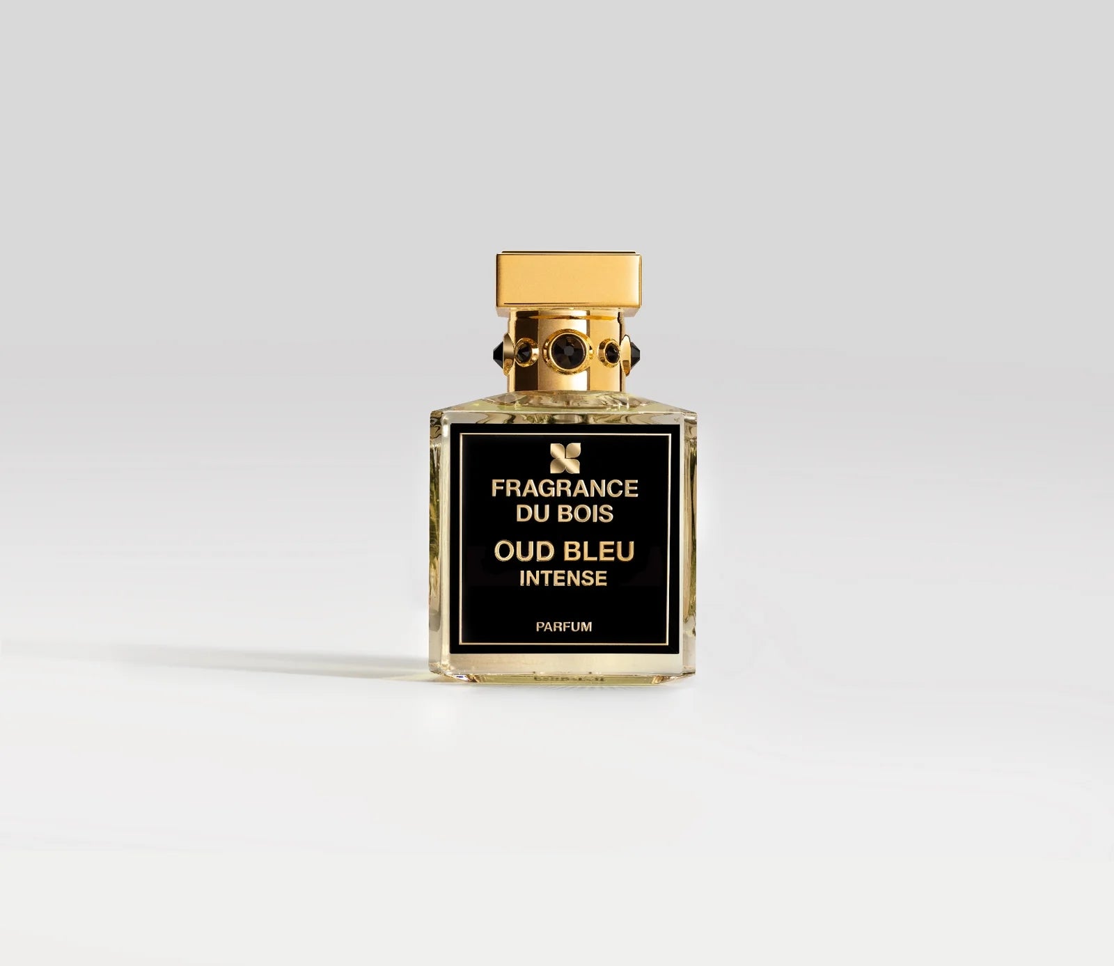 Transparentes Parfüm Flakon von Fragrance Du Bois Oud Bleu Intense mit goldenem Deckel