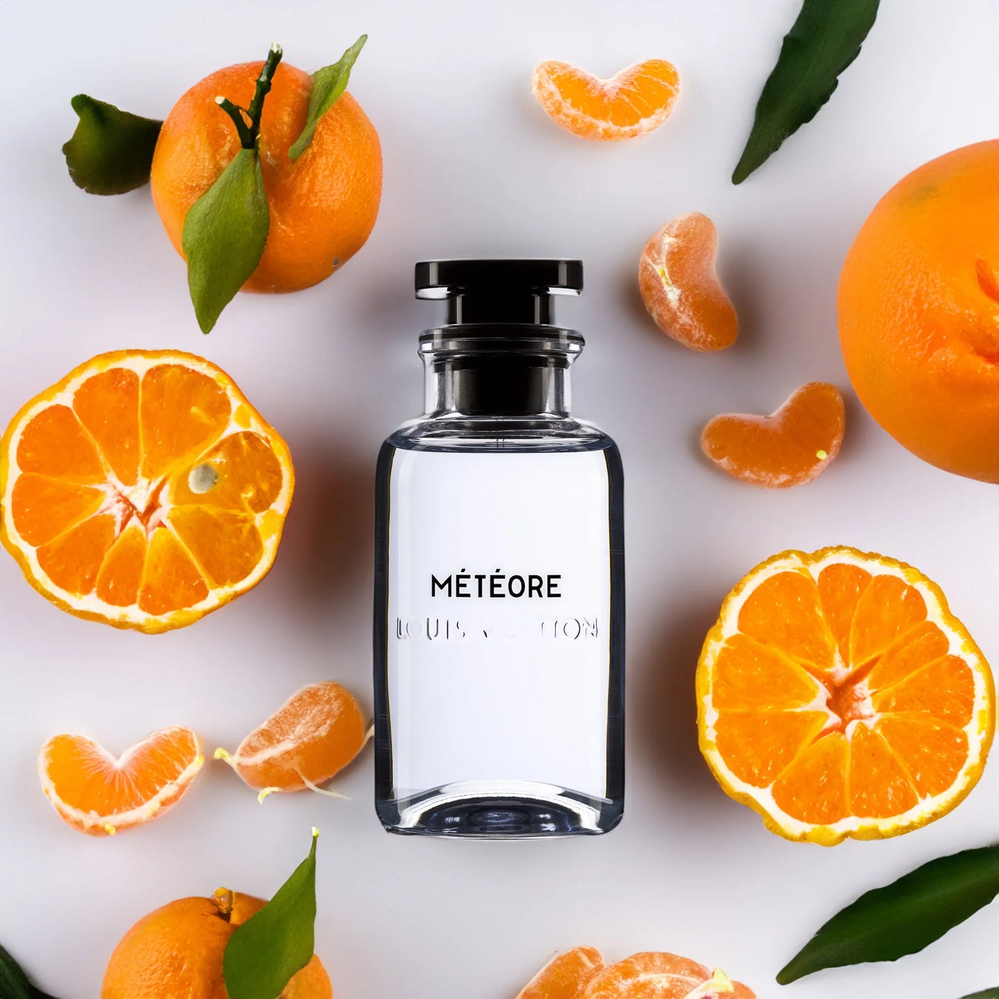 Parfüm Flakon von Louis Vuitton Meteore mit Orangen und Mandarinen